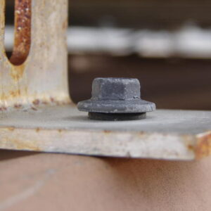 Rusted tin roof bracket -12 month after install Rusted tin roof bracket -12 month after install